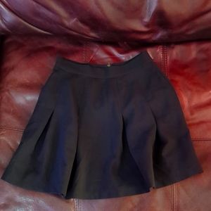 Black pleated mini skirt